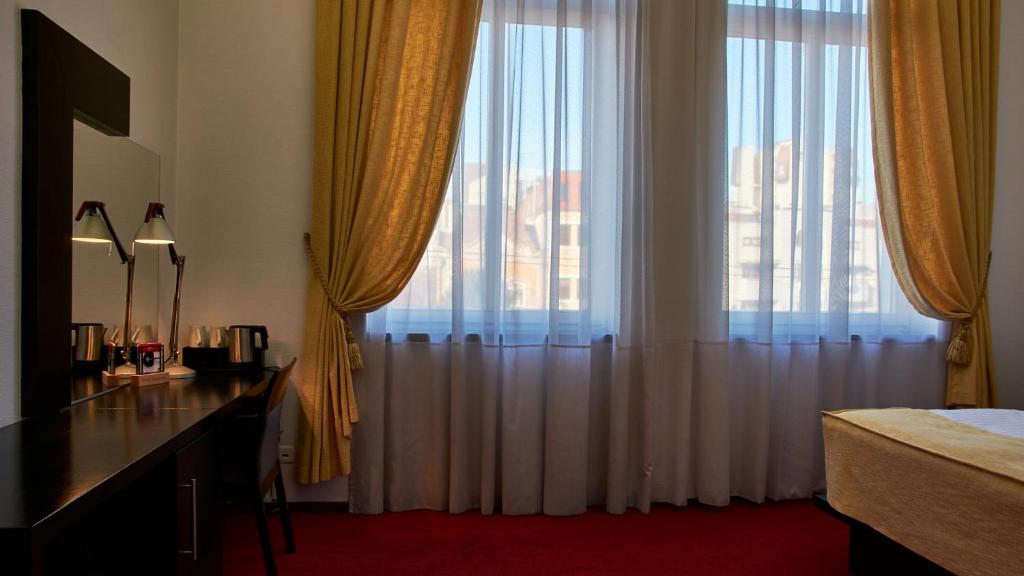 TV a/nebo společenská místnost v ubytování Hotel Concordia