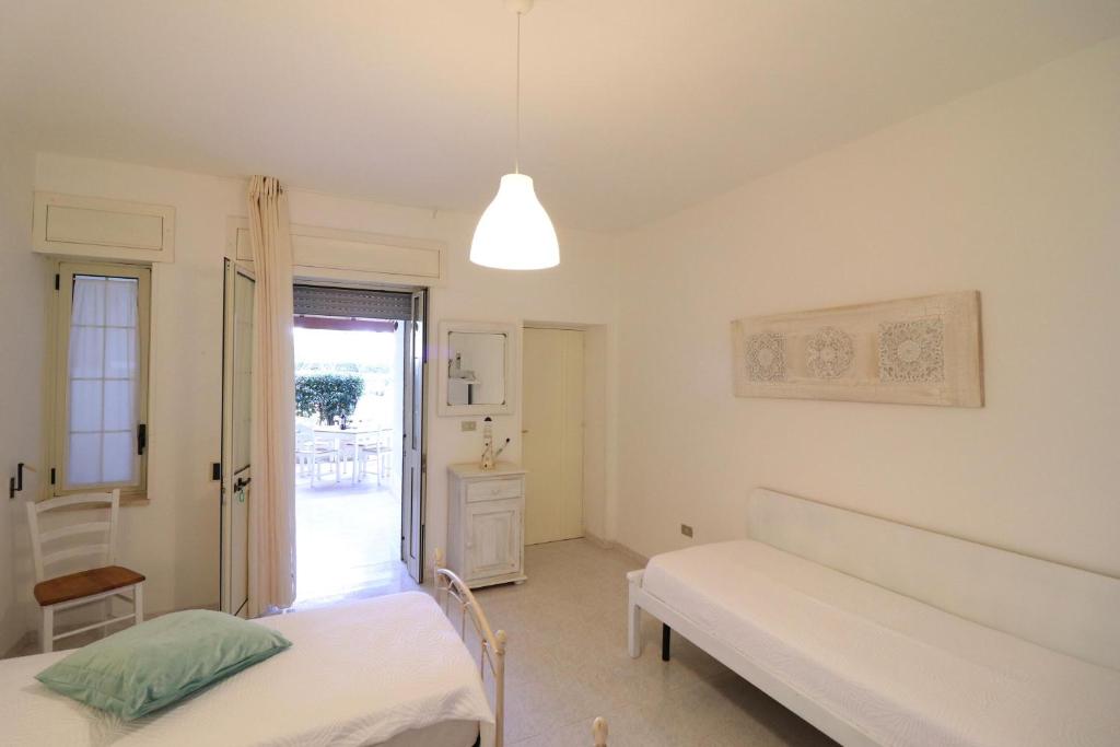 A bed or beds in a room at Casa Cabernet Torre Santo Stefano