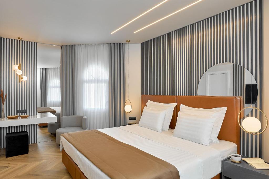 Posteľ alebo postele v izbe v ubytovaní Grand Hotel Palace