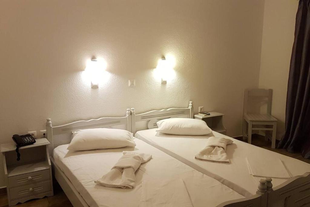 Postel nebo postele na pokoji v ubytování Captain's Rocks Hotel