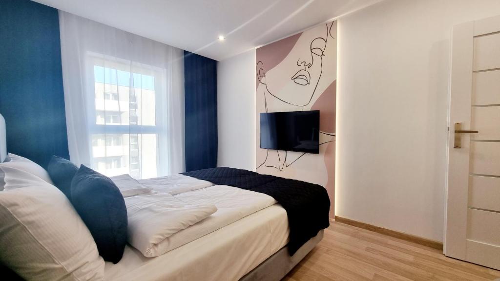 Posteľ alebo postele v izbe v ubytovaní NOOK NOOK Apartments Bytkowska 103