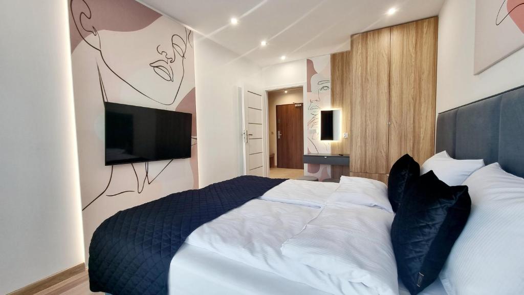 Posteľ alebo postele v izbe v ubytovaní NOOK NOOK Apartments Bytkowska 103