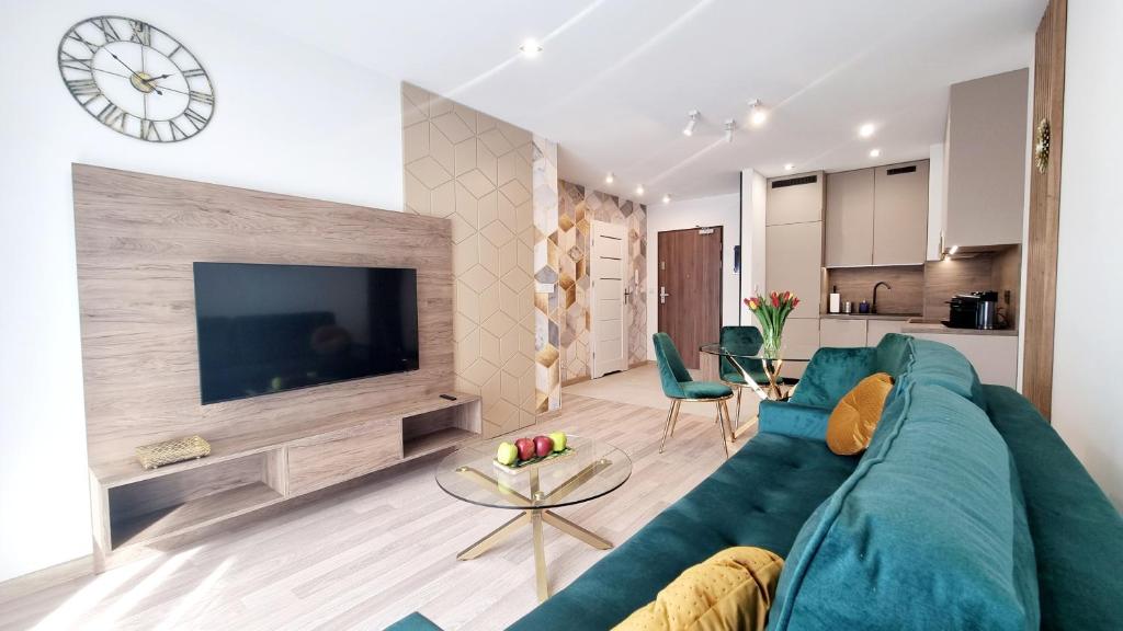 Televízia a/alebo spoločenská miestnosť v ubytovaní NOOK NOOK Apartments Bytkowska 103
