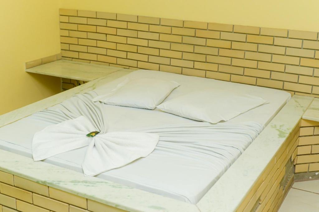 Postel nebo postele na pokoji v ubytování Hotel Luma