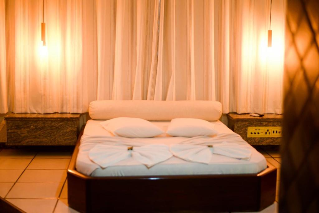 Postel nebo postele na pokoji v ubytování Hotel Luma