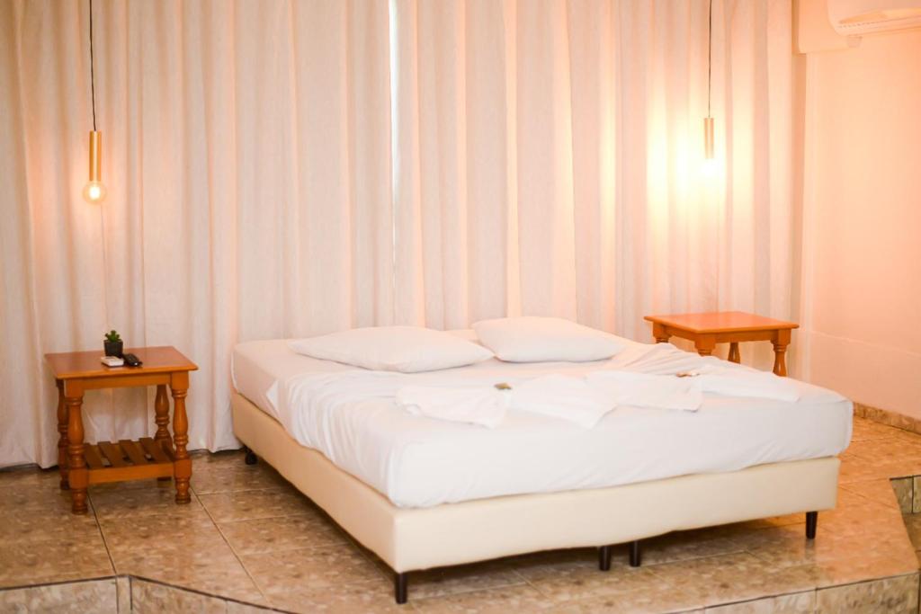 Postel nebo postele na pokoji v ubytování Hotel Luma