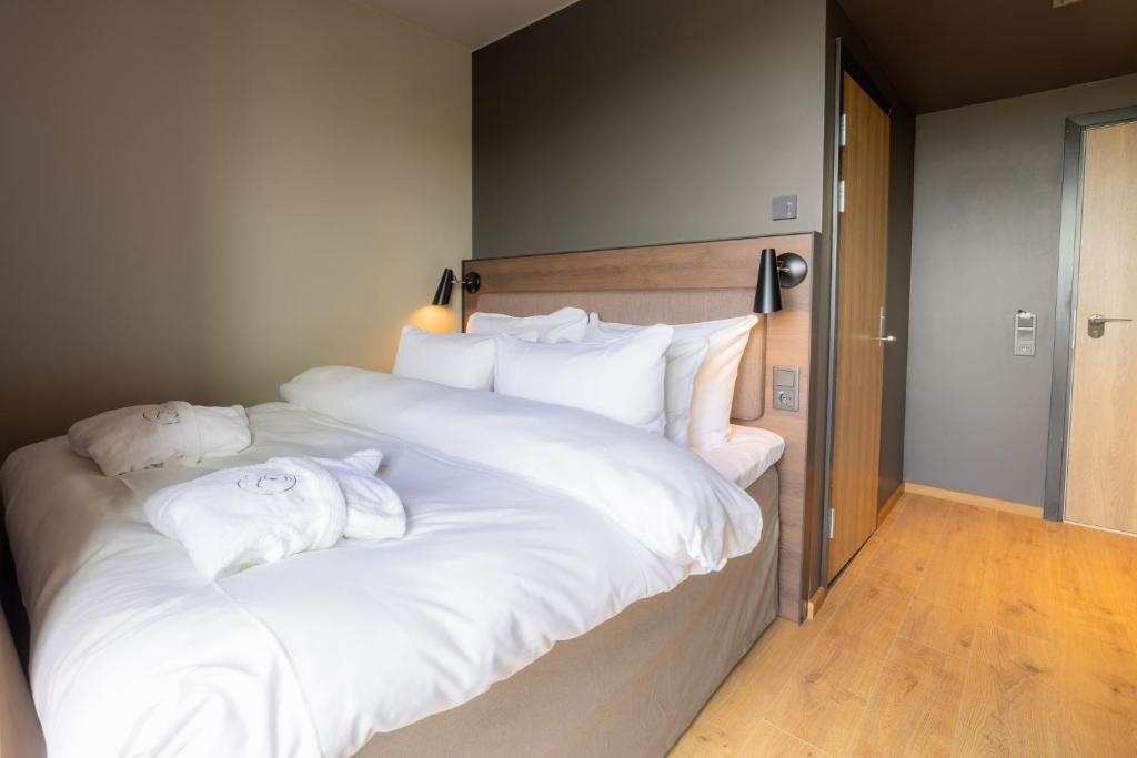 Postel nebo postele na pokoji v ubytování Lily Country Club