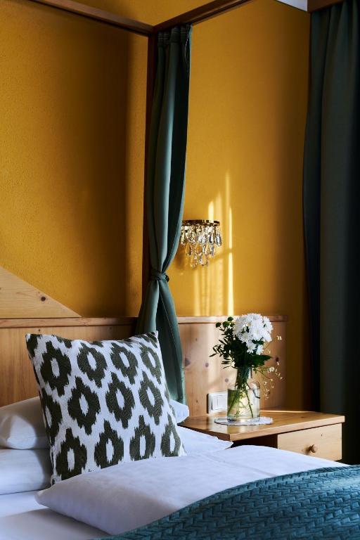 Postel nebo postele na pokoji v ubytování Hotel Garni Thermenoase