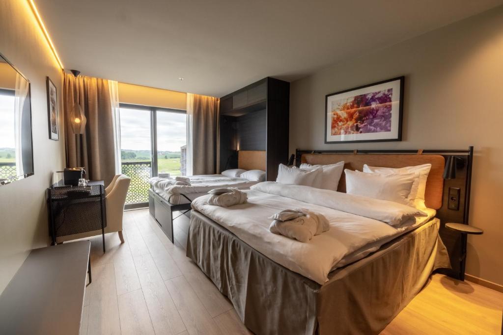 Postel nebo postele na pokoji v ubytování Lily Country Club