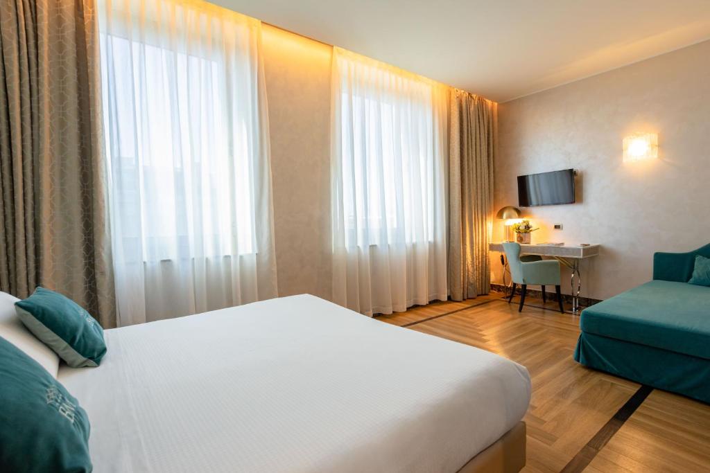 Postel nebo postele na pokoji v ubytování Bianca Maria Palace Hotel