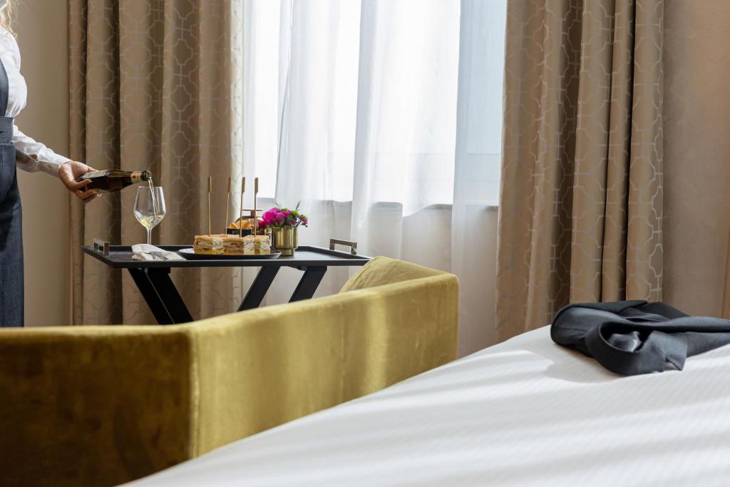 Postel nebo postele na pokoji v ubytování Bianca Maria Palace Hotel