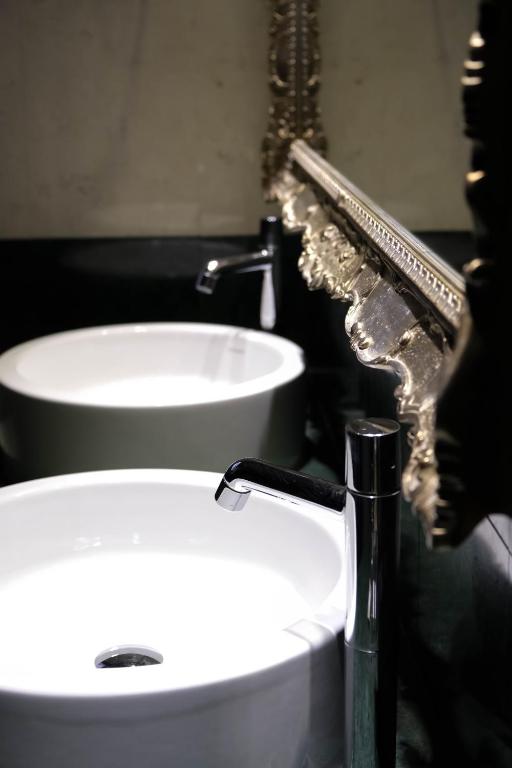Koupelna v ubytování Settecento Hotel