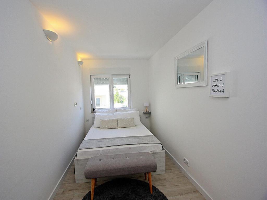 Postel nebo postele na pokoji v ubytování Apartments Tomy