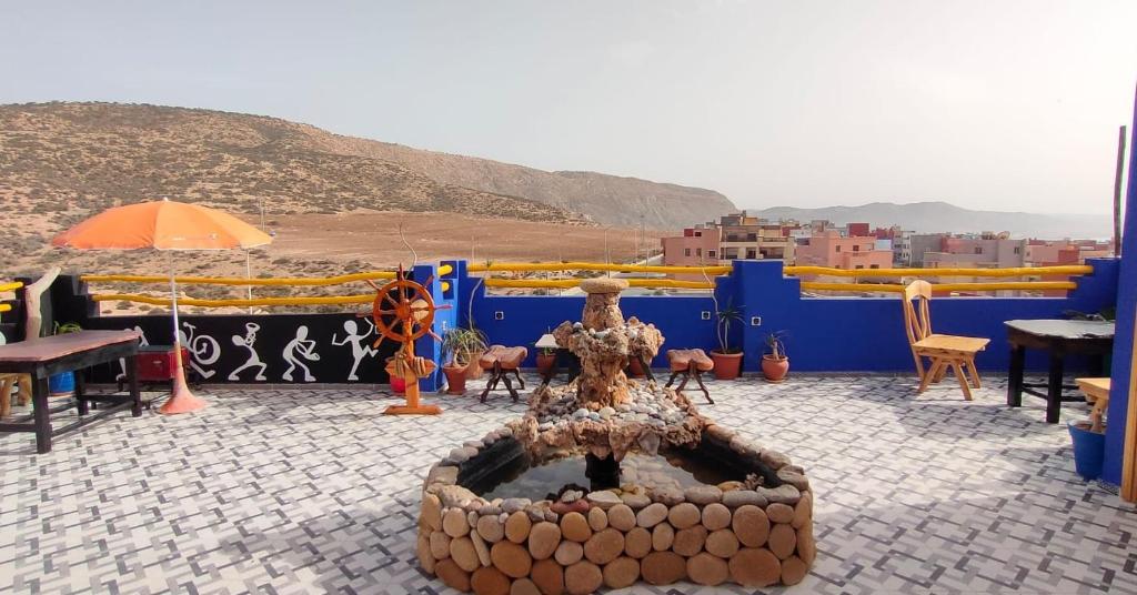 a fire pit on the roof of a building at Light House Imsouane in Imsouane