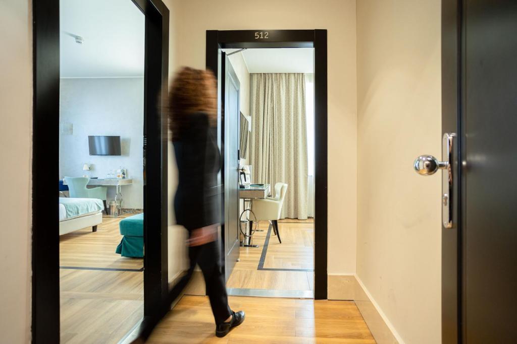 Postel nebo postele na pokoji v ubytování Bianca Maria Palace Hotel