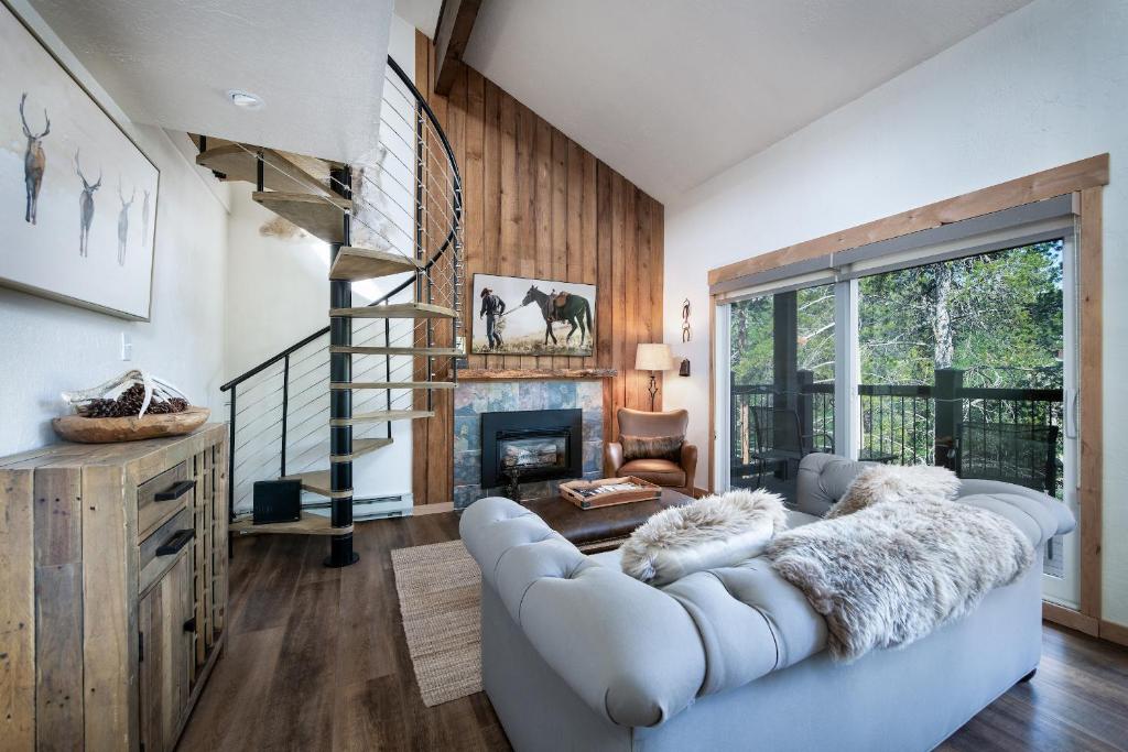 a living room with a couch and a fireplace at Inner Circle 15 Serenity Condo Great Breck Location in Breckenridge