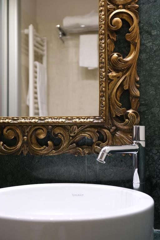 Koupelna v ubytování Settecento Hotel