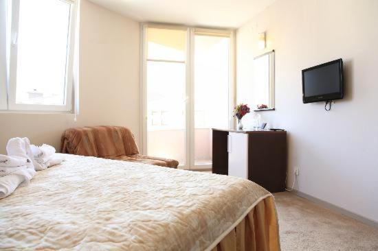 Postel nebo postele na pokoji v ubytování Hotel Lebed