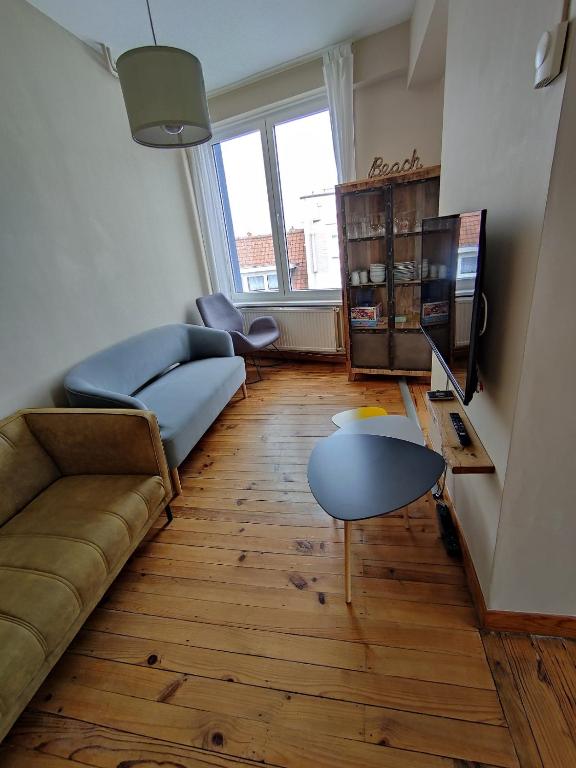 Coin salon dans l'établissement Apt 6 pers. Duplex vue mer avec charme de l'ancien