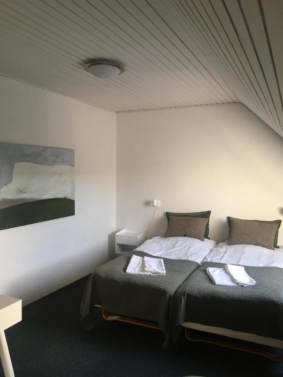 Postel nebo postele na pokoji v ubytování Roslev Hus