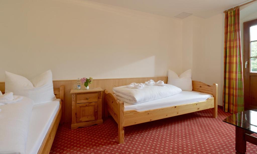 Postel nebo postele na pokoji v ubytování Posthotel Mayrhofen