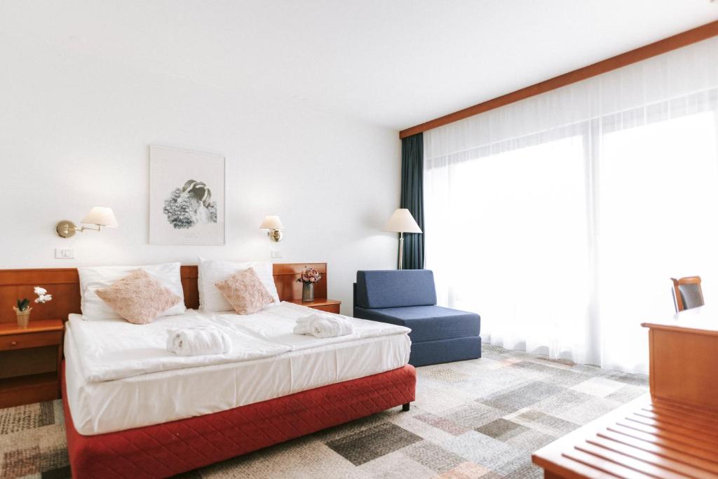 Postel nebo postele na pokoji v ubytování Hotel Toplice - Terme Čatež