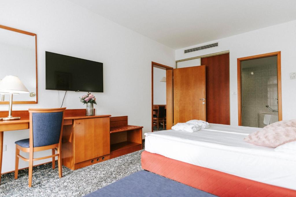 Postel nebo postele na pokoji v ubytování Hotel Toplice - Terme Čatež