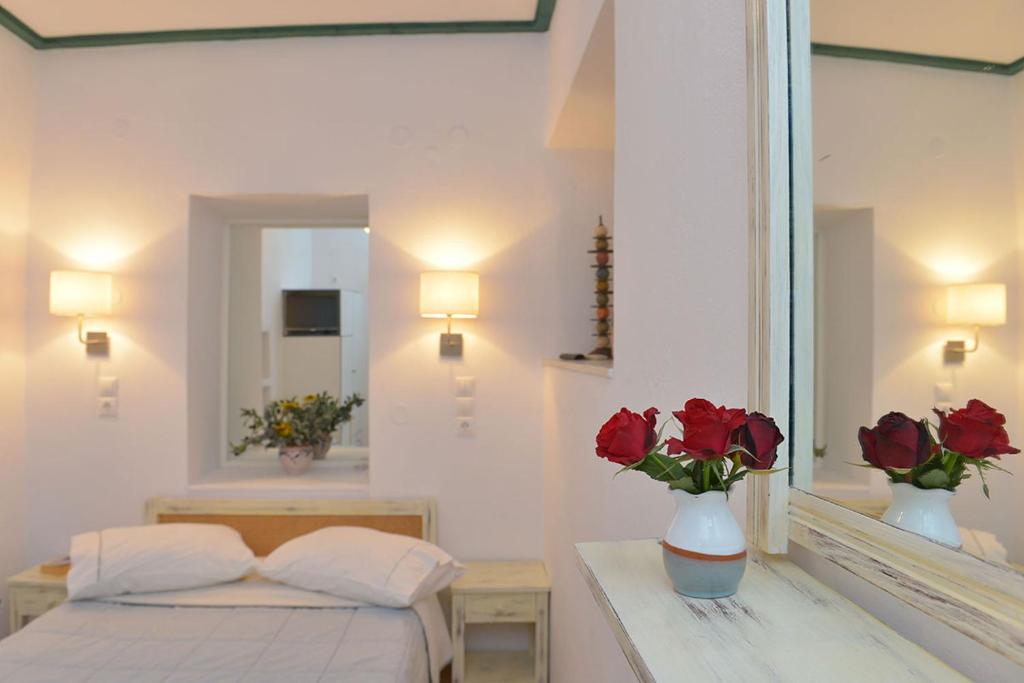 Postel nebo postele na pokoji v ubytování Anthousa Hotel
