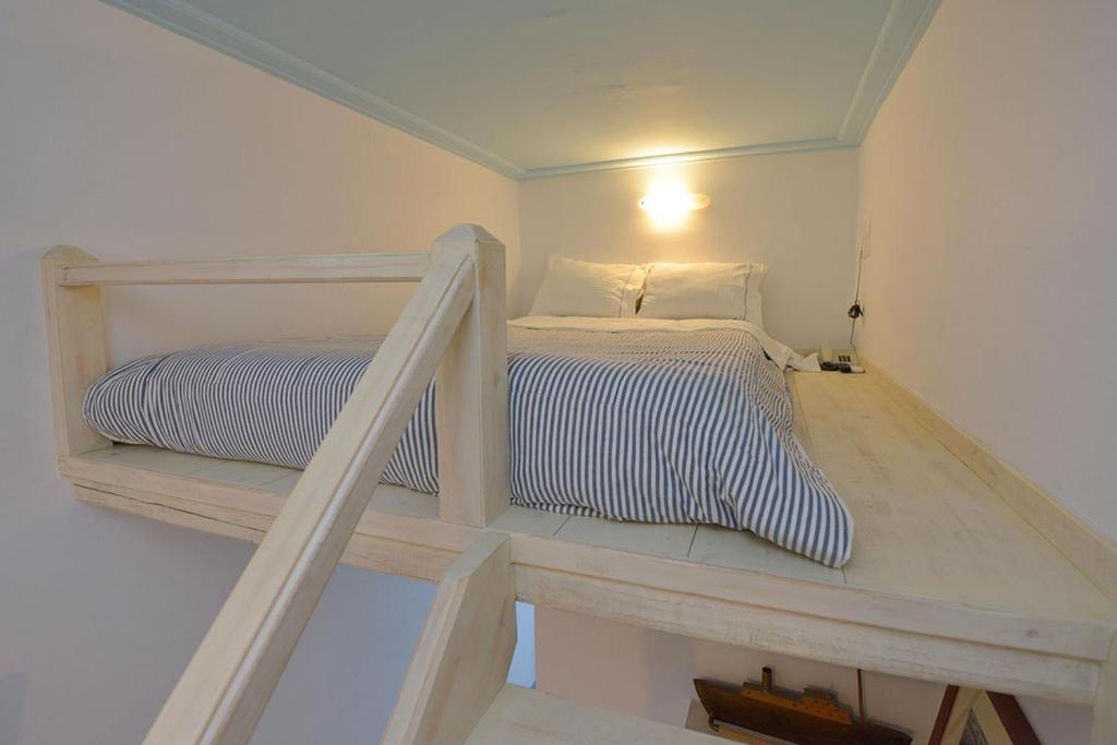 Postel nebo postele na pokoji v ubytování Anthousa Hotel