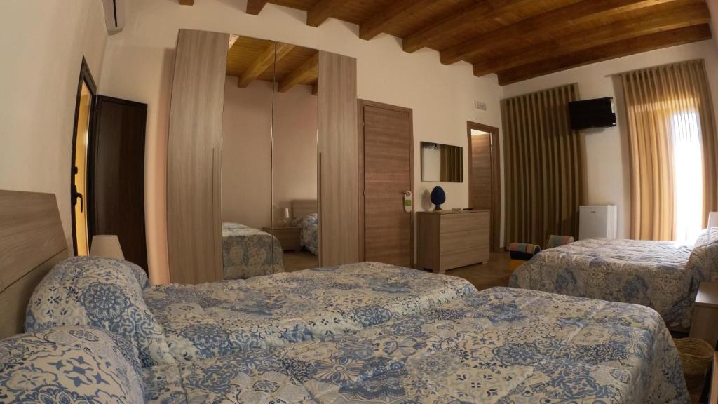 Postel nebo postele na pokoji v ubytování Le Vie di Girgenti