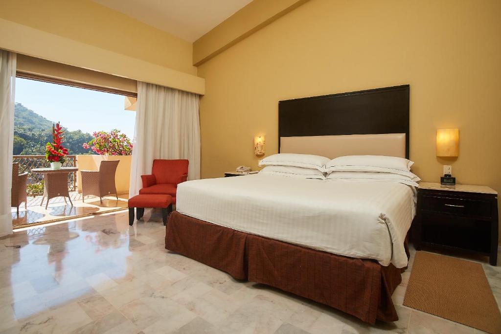 Postel nebo postele na pokoji v ubytování Barceló Puerto Vallarta - All Inclusive