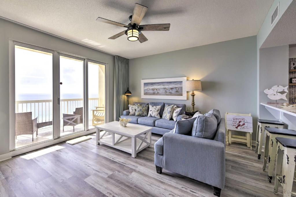 a living room with a couch and a table at Panama City Beach Condo w/ Free Beach Service! in Panama City Beach
