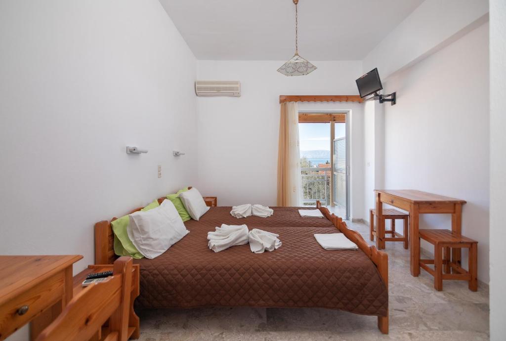 Postel nebo postele na pokoji v ubytování Corfu Star Apartments