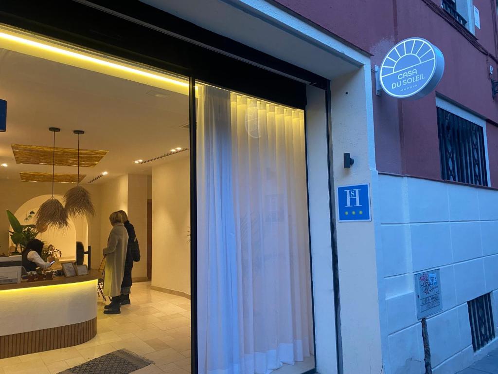 Postel nebo postele na pokoji v ubytování Casa du Soleil Hostal Boutique