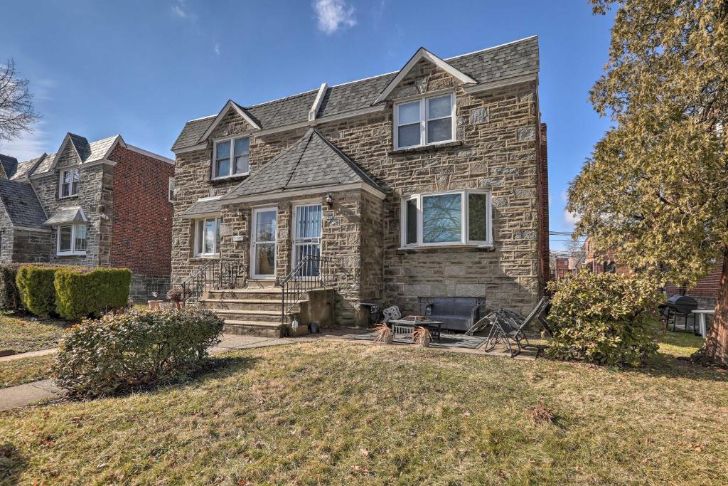 a large stone house with a yard at Family-Friendly Getaway 11 Mi to Dtwn Philly in Philadelphia