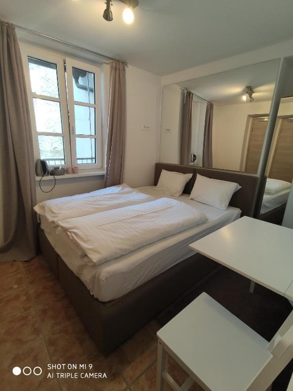 Postel nebo postele na pokoji v ubytování Aparthotel Cross Street 4