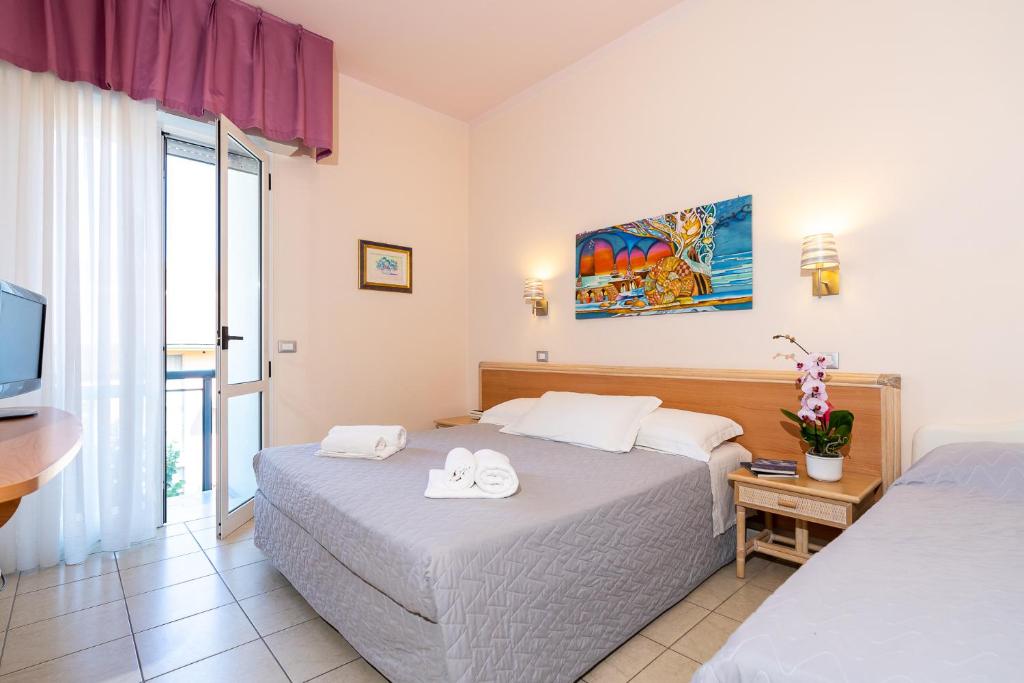 Postel nebo postele na pokoji v ubytování Hotel Tirsus