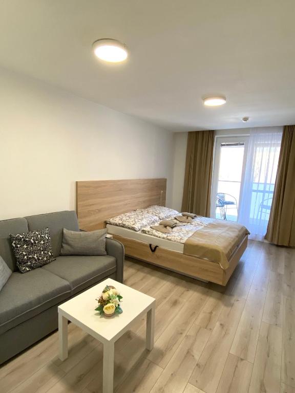 Postel nebo postele na pokoji v ubytování Apartmán Flower