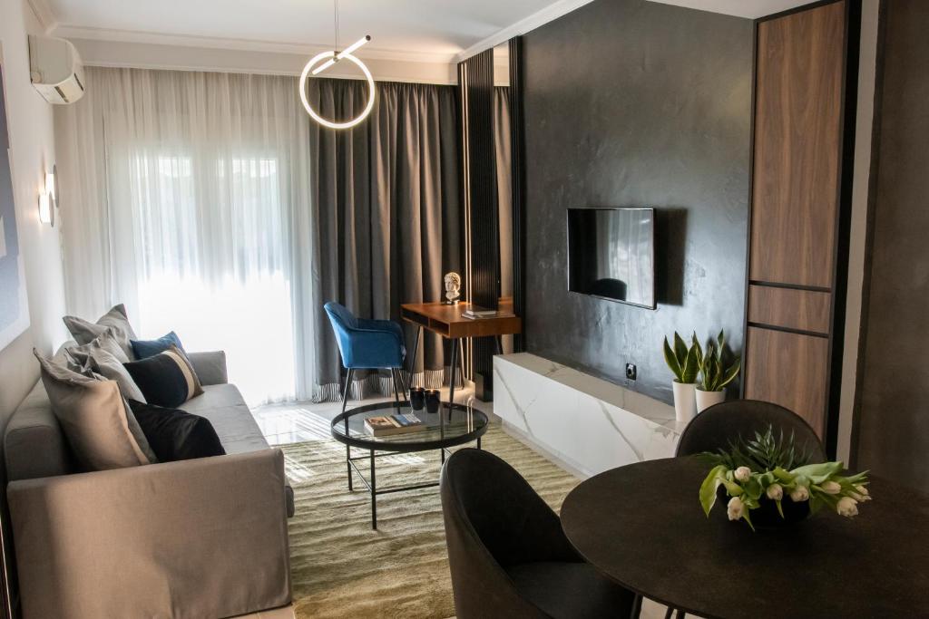 a living room with a couch and a table at Veria Suite in Veria