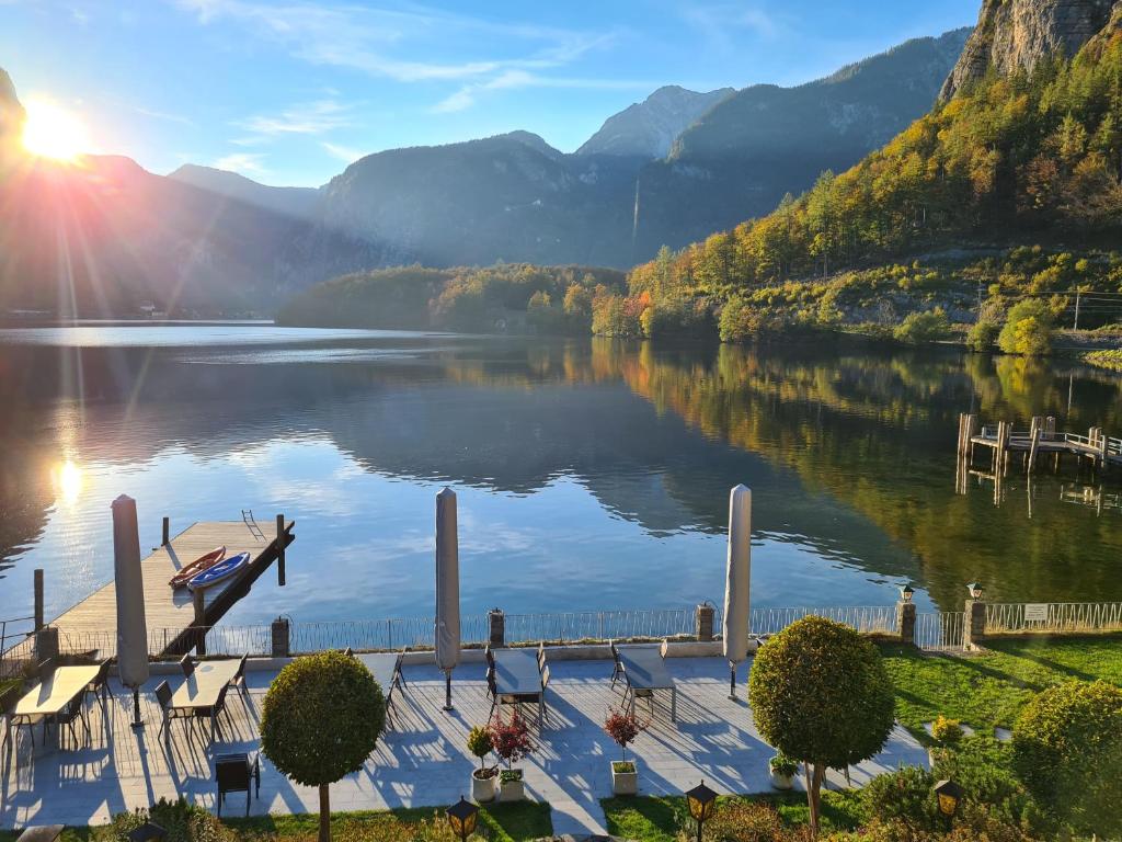 a view of a lake with a boat on a dock at B&B Hallstatt Lake - self check in in Obertraun