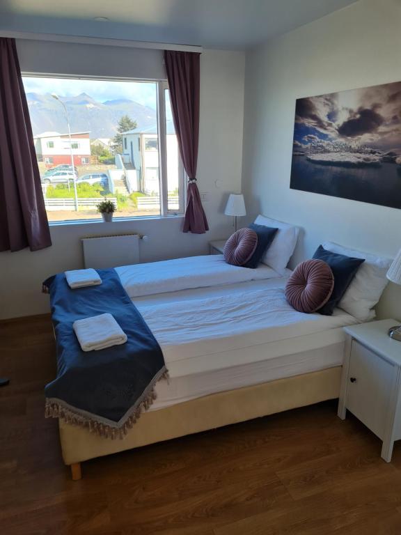 Postel nebo postele na pokoji v ubytování Höfn Guesthouse