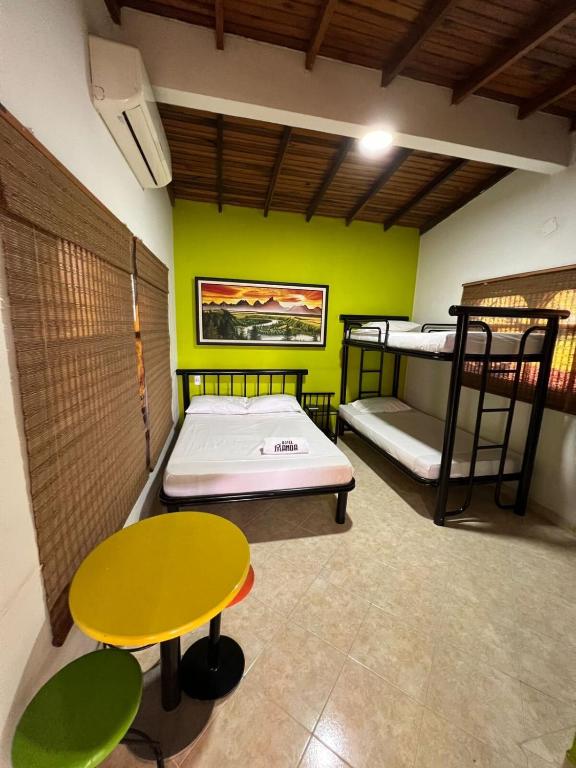 Voodi või voodid majutusasutuse Hotel Manoa toas