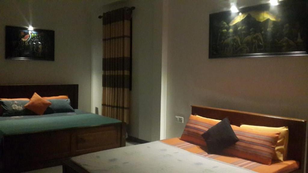 Postel nebo postele na pokoji v ubytování Hanthana view