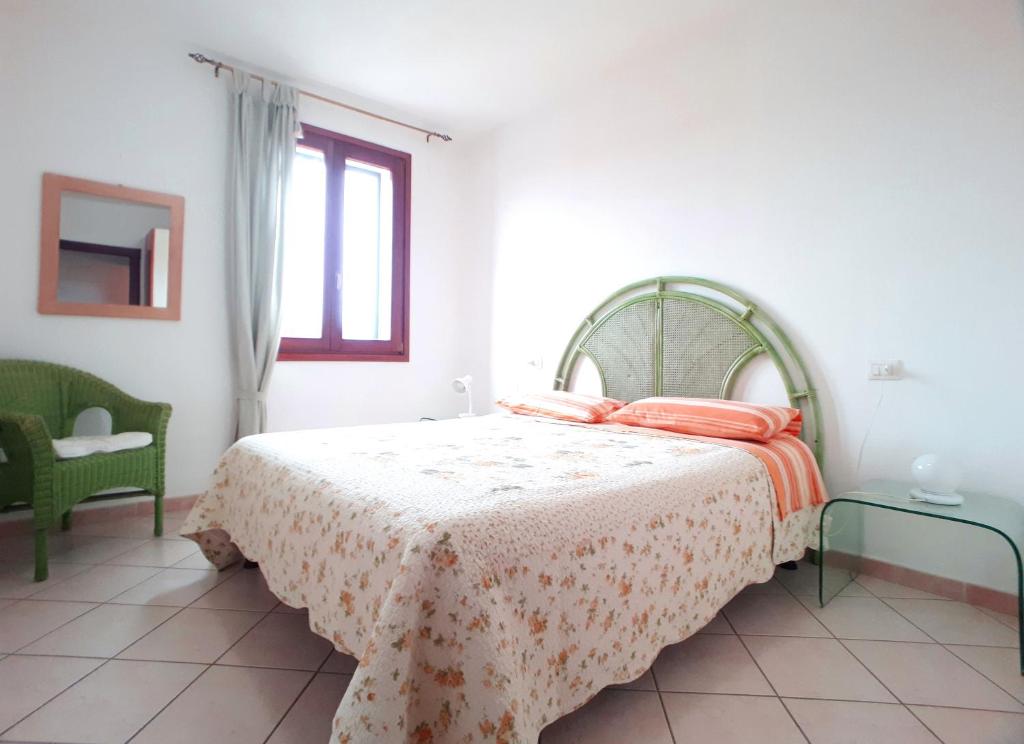 A bed or beds in a room at Santa Teresa Sea View apartment - Private Parking & WiFi