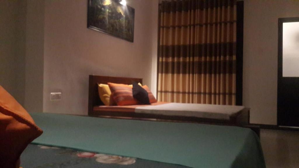 Postel nebo postele na pokoji v ubytování Hanthana view