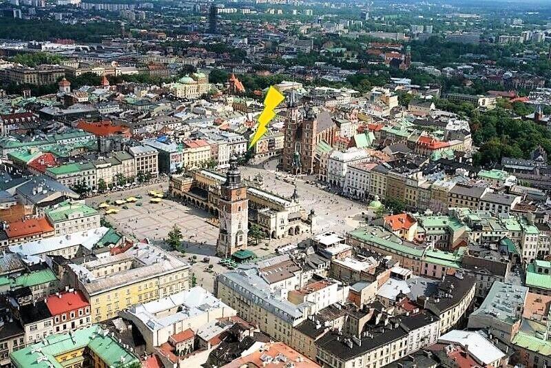an aerial view of a city with a yellow flag at Floriańska NewTown in Krakow