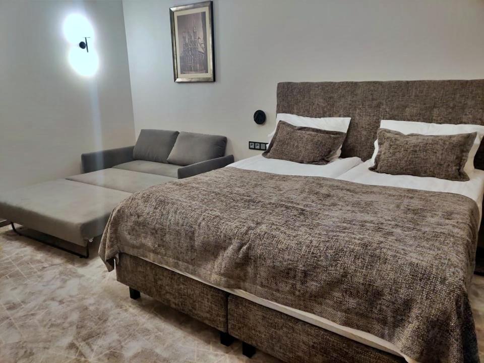 Postel nebo postele na pokoji v ubytování Vvinn Hotel