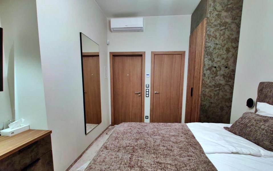 Postel nebo postele na pokoji v ubytování Vvinn Hotel