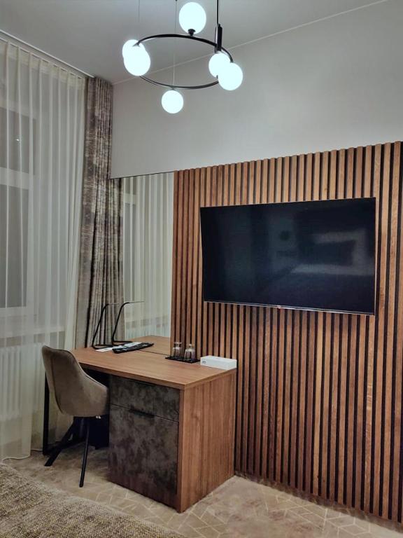 TV a/nebo společenská místnost v ubytování Vvinn Hotel