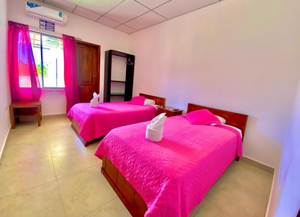 Postel nebo postele na pokoji v ubytování Hostal Punta Arena